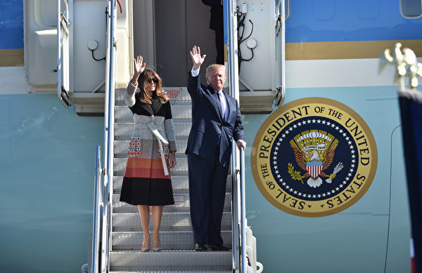 US President Donald Trump (R) and his wife Melania arrive at Yokota Air Base in Tokyo on November 5, 2017. Trump touched down in Japan, kicking off the first leg of a high-stakes Asia tour set to be dominated by soaring tensions with nuclear-armed North Korea. / AFP PHOTO / Kazuhiro NOGI AND KAZUHIRO NOGI (Photo credit should read KAZUHIRO NOGI/AFP/Getty Images)