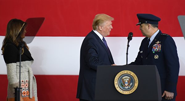 US President Donald Trump (C) shakes hands with US forces Japan commamder Lt General Jerry Martinez (R) as US First Lady Melania looks on upon arriving at US Yokota Air Base in Tokyo on November 5, 2017. Trump touched down in Japan, kicking off the first leg of a high-stakes Asia tour set to be dominated by soaring tensions with nuclear-armed North Korea. / AFP PHOTO / Toshifumi KITAMURA (Photo credit should read TOSHIFUMI KITAMURA/AFP/Getty Images)