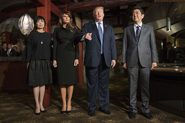 US President Donald Trump (2nd R) and Japan's Prime Minister Shinzo Abe meet with their wives Melania Trump (2nd L) and Akie Abe (L) for a dinner at a restaurant in Tokyo on November 5, 2017. Trump touched down in Japan on November 5, kicking off the first leg of a high-stakes Asia tour set to be dominated by soaring tensions with nuclear-armed North Korea. / AFP PHOTO / JIM WATSON (Photo credit should read JIM WATSON/AFP/Getty Images)