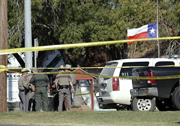 SUTHERLAND SPRINGS, TX - NOVEMBER 5: Law enforcement officials gather near the First Baptist Church following a shooting on November 5, 2017 in Sutherland Springs, Texas. At least 20 people were reportedly killed and 24 injured when a gunman, identified as Devin P. Kelley, 26, allegedly entered the church during a service and opened fire. (Photo by Erich Schlegel/Getty Images)