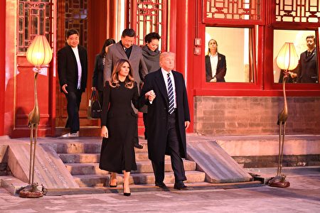 US President Donald Trump (front R) walks with First Lady Melania Trump (front L) as they tour the Forbidden City with China's President Xi Jinping (2nd row L) and his wife Peng Liyuan (2nd row R) in Beijing on November 8, 2017. US President Donald Trump toured the Forbidden City with Chinese leader Xi Jinping on November 8 as he began the crucial leg of an Asian tour intended to build a global front against North Korea's nuclear threats. / AFP PHOTO / Jim WATSON (Photo credit should read JIM WATSON/AFP/Getty Images)