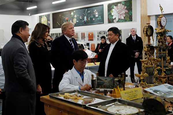 US President Donald Trump (3rd L), First Lady Melania Trump (2nd L) and China's President Xi Jinping (L) tour the Conservation Scientific Laboratory of the Forbidden City in Beijing on November 8, 2017. US President Donald Trump toured the Forbidden City with Chinese leader Xi Jinping on November 8 as he began the crucial leg of an Asian tour intended to build a global front against North Korea's nuclear threats. / AFP PHOTO / POOL / Andy Wong (Photo credit should read ANDY WONG/AFP/Getty Images)
