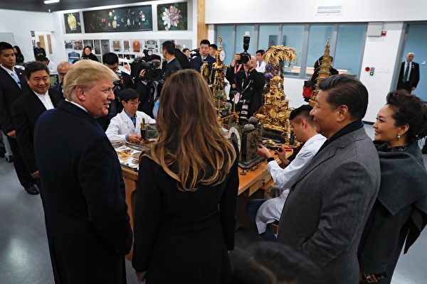 US President Donald Trump (front L) talks with First Lady Melania Trump (front 2nd L) as they tour the Conservation Scientific Laboratory of the Forbidden City with China's President Xi Jinping (front 2nd R) and his wife Peng Liyuan (fronrt R) in Beijing on November 8, 2017. US President Donald Trump toured the Forbidden City with Chinese leader Xi Jinping on November 8 as he began the crucial leg of an Asian tour intended to build a global front against North Korea's nuclear threats. / AFP PHOTO / POOL / Andy Wong (Photo credit should read ANDY WONG/AFP/Getty Images)