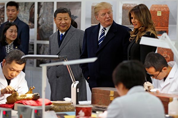 US President Donald Trump (back 2nd R), First Lady Melania Trump (back R) and China's President Xi Jinping (back L) tour the Conservation Scientific Laboratory of the Forbidden City in Beijing on November 8, 2017. US President Donald Trump toured the Forbidden City with Chinese leader Xi Jinping on November 8 as he began the crucial leg of an Asian tour intended to build a global front against North Korea's nuclear threats. / AFP PHOTO / POOL / Andy Wong (Photo credit should read ANDY WONG/AFP/Getty Images)