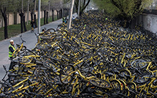 成都上百共享单车被“活埋” 上海故障车近半