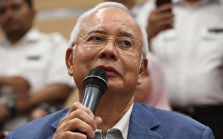 马来西亚政大变天 纳吉被禁出国 安华将出狱