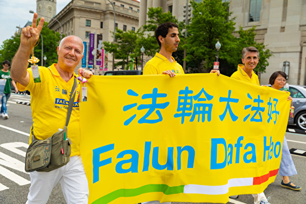6月20日，全球部分法轮功学员聚集在美国首府华盛顿DC，举行反迫害集会游行。（Mark Zou/大纪元）