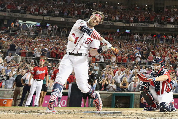 WASHINGTON, DC - JULY 16: Bryce Harper of the Washington Nationals and National League hits his final home run to win the T-Mobile Home Run Derby at Nationals Park on July 16, 2018 in Washington, DC. Harper defeated Kyle Schwarber of the Chicago Cubs and National League 19-18.