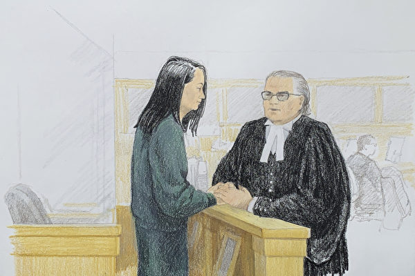 華為公司首席財務官孟晚舟在12月10日加拿大卑詩省保釋庭上與她的律師說話。（Jane Wolsak/Jane Wolsak/AFP）