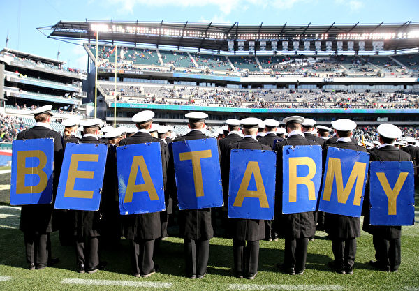 PHILADELPHIA, PENNSYLVANIA - DECEMBER 08:  The Naval cadets march on the field before the game between the Army Black Knights and the Navy Midshipmen at Lincoln Financial Field on December 08, 2018 in Philadelphia, Pennsylvania. (Photo by Elsa/Getty Images)