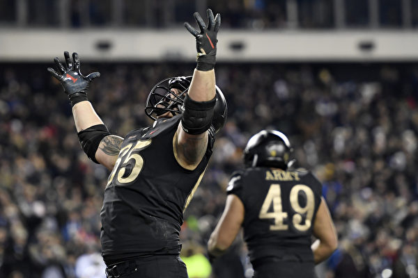 PHILADELPHIA, PENNSYLVANIA - DECEMBER 08: Bryce Holland #65 of the Army Black Knights reacts after the Black Knights score a touchdown in the fourth quarter to win the game 17-10 over the Navy Midshipmen at Lincoln Financial Field on December 08, 2018 in Philadelphia, Pennsylvania. (Photo by Sarah Stier/Getty Images)