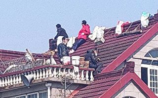 对抗强拆 上海聋哑人一家在屋顶坚守家园