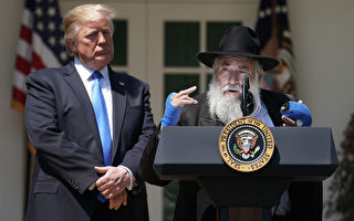 President And Mrs Trump Host National Day Of Prayer Service At White House WASHINGTON, DC - MAY 02: U.S. President Donald Trump (L) listens to Congregation Chabad Rabbi Yisroel Goldstein of Poway, California, speak during a National Day of Prayer service in the Rose Garden at the White House May 02, 2019 in Washington, DC. Goldstein suffered defensive wounds when a gunman opened fire during the last day of Passover services at his synagogue, killing Lori Kaye. The White House invited leaders from various faiths and religions to participate in the day of prayer, which was designated in 1952 by the United States Congress to ask people "to turn to God in prayer and meditation." (Photo by Chip Somodevilla/Getty Images)