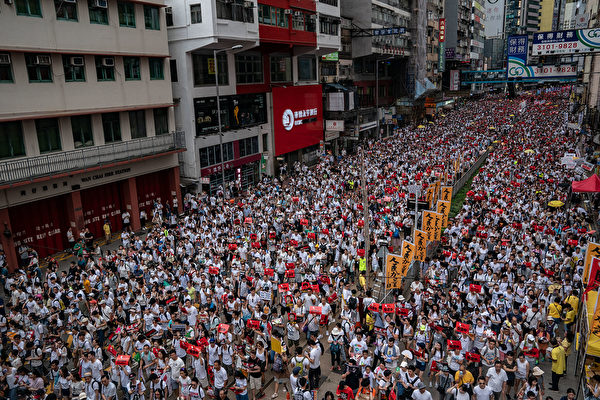 HONG KONG, HONG KONG - JUNE 09: Protesters march on a street during a rally against the extradition law proposal on June 9, 2019 in Hong Kong China. Hundreds of thousands of protesters marched in Hong Kong in Sunday against a controversial extradition bill that would allow suspected criminals to be sent to mainland China for trial.(Photo by 