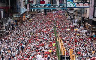 HONG KONG - JUNE 09: Protesters march on a street during a rally against a controversial extradition law proposal on June 9, 2019 in Hong Kong. Organizers say more than a million protesters marched in Hong Kong on Sunday against a bill that would allow suspected criminals to be sent to mainland China for trial as tensions have escalated in recent weeks. (Photo by