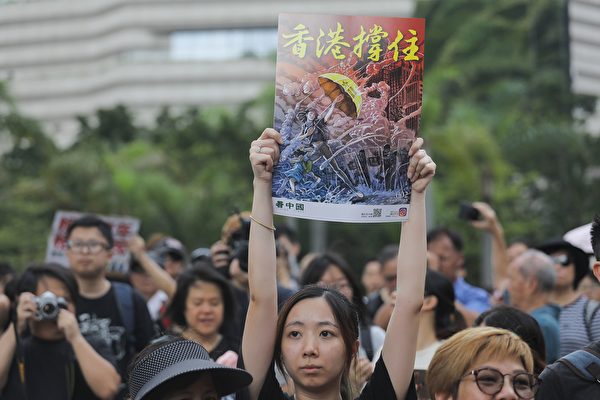 Protesters gather before a march to the West Kowloon railway station, where high-speed trains depart for the Chinese mainland, during a demonstration against a proposed extradition bill in Hong Kong on July 7, 2019. - Hong Kong has been rocked by a month of huge peaceful protests as well as a series of separate violent youth-led confrontations sparked by a proposed law that would have allowed extraditions to mainland China. (Photo by Vivek PRAKASH / AFP) (Photo credit should read
