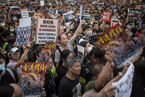 HONG KONG, HONG KONG - JULY 07: Protesters march towards the West Kowloon railway station during a protest against the proposed extradition bill on July 7, 2019. in Hong Kong, China. Thousands of protesters marched to the train station which links Hong Kong to the Chinese mainland. Pro-democracy demonstrations have continued on the streets of Hong Kong for the past month, calling for the complete withdrawal of a controversial extradition bill. Hong Kong's Chief Executive Carrie Lam has suspended the bill indefinitely, however protests have continued with demonstrators now calling for her resignation. (Photo by