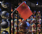 BEIJING, CHINA - OCTOBER 09: (IMAGE TAKEN WITH MOBILE PHONE CAMERA) A Chinese flag is seen placed on basketballs in the NBA flagship retail store on October 9, 2019 in Beijing, China. The NBA is trying to salvage its brand in China amid criticism of its handling of a controversial tweet that infuriated the government and has jeopardized the leagues Chinese expansion. The crisis, triggered by a Houston Rockets executives tweet that praised protests in Hong Kong, prompted the Chinese Basketball Association to suspend its partnership with the league. The backlash continued with state-owned television CCTV scrapping its plans to broadcast pre-season games in Shanghai and Shenzhen, and the cancellation of other promotional fan events. The league issued an apology, though NBA Commissioner Adam Silver angered Chinese officials further when he defended the right of players and team executives to free speech. China represents a lucrative market for the NBA, which stands to lose millions of dollars in revenue and threatens to alienate Chinese fans. Many have taken to Chinas social media platforms to express their outrage and disappointment that the NBA would question the countrys sovereignty over Hong Kong which has been mired in anti-government protests since June.(Photo by Kevin Frayer/Getty Images)