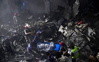 组图：巴基斯坦客机坠毁住宅区 97人罹难