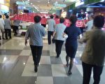【一线采访】济南商场逾百保洁员游行讨薪