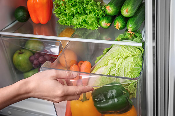 Woman,Opening,Drawer,Of,Refrigerator,With,Vegetables