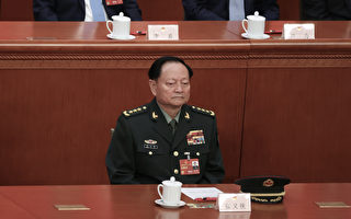 2023年3月11日，张又侠坐在主席台上。（Lintao Zhang/Getty Images）