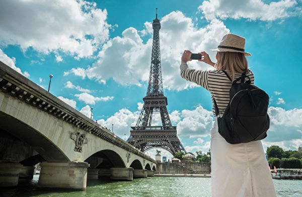 Woman Tourist Selfie Near The Eiffel Tower In Paris Under