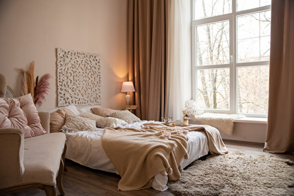 Bedroom In Beige Tones With A Large Bed And A