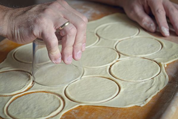 Making Dumplings Or Pierogi Preparing Rounded Pieces Of Dough With