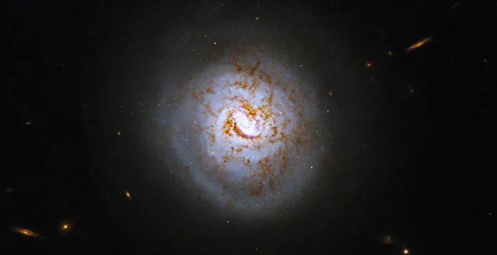 Spiral Galaxy ESO 420-G013 and Blue Dense Galaxy ESO 185-IG013: NASA’s Hubble Space Telescope Captures Stunning Images