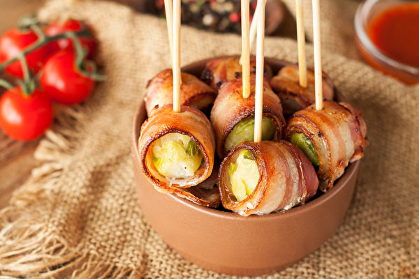 Bacon Wrapped Brussels Sprouts Served With Cherry Tomatoes In Ceramic
