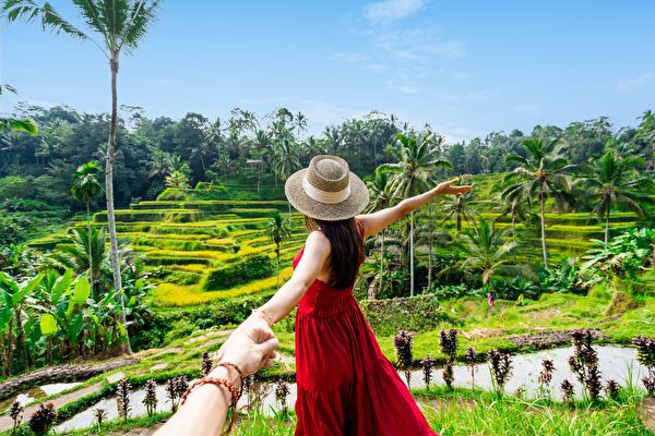 Young Couple Traveler Looking At The Beautiful Tegalalang Rice Terrace