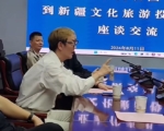 前上海首富周正毅現身新疆 染黃髮引關注